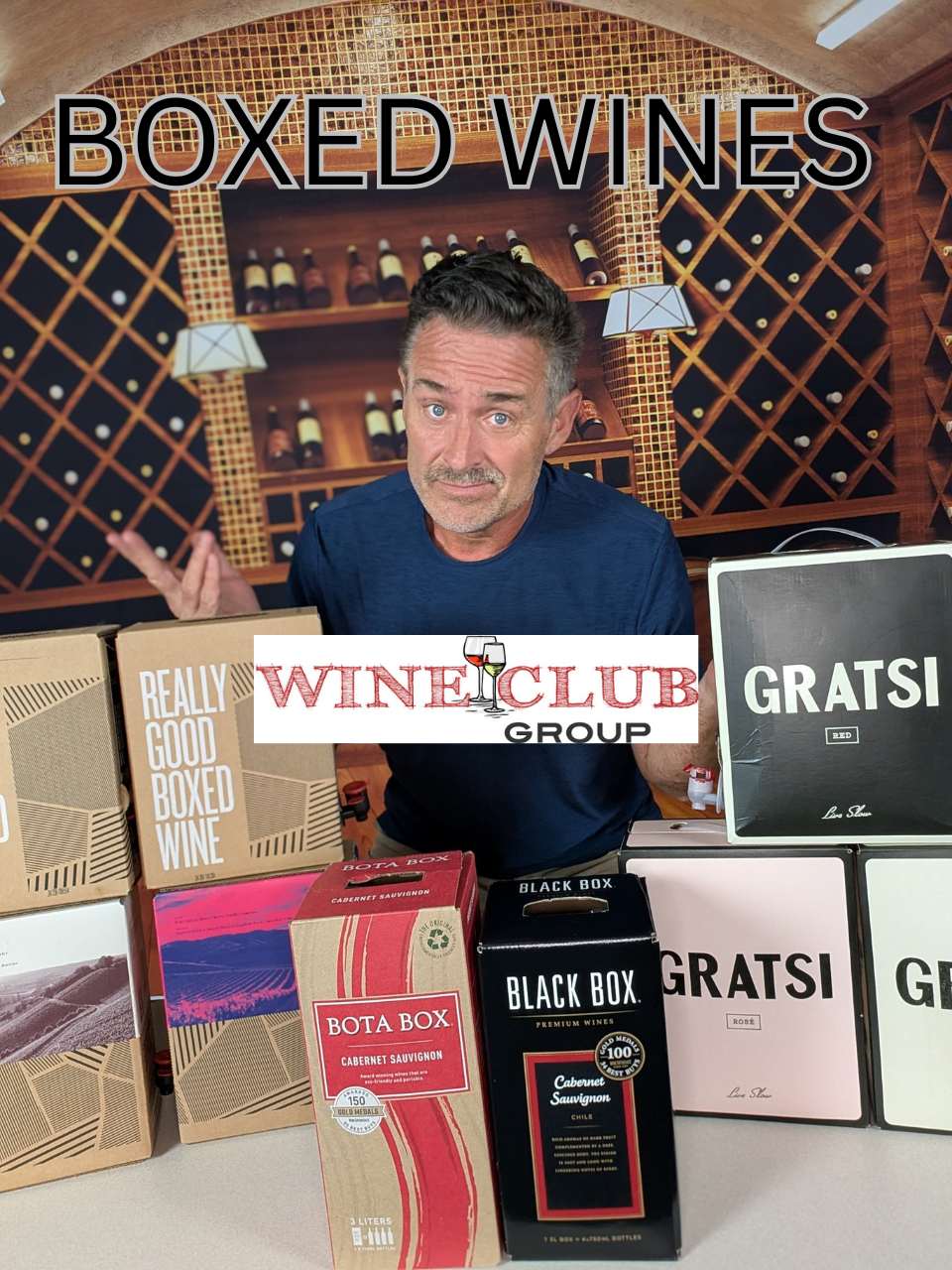 Todd shrugging behind an array of boxed wines (Bota Box, Black Box, Gratsi, Really Good Boxed Wine) for a wineclubgroup.com boxed-wine roundup, with WineClubGroup logo overlaid